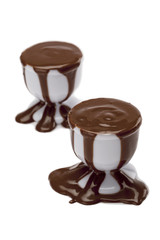 a cup with overflowing chocolate syrup
