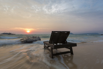 Empty beach with beach bed on sunrise in Koh Rong, Cambodia
