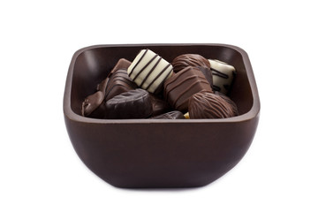 a bowl of chocolate candies