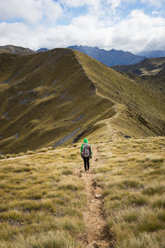Woman hiker walking on an alpine section of the Kepler Track