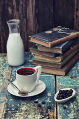 vintage books, with coffee cup and milk on a retro set up