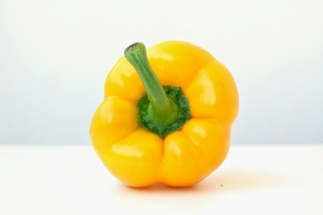 Yellow pepper on the white background