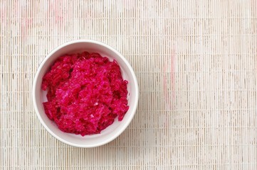 Obraz na płótnie Canvas sauerkraut and red beet in the bawl on the white background