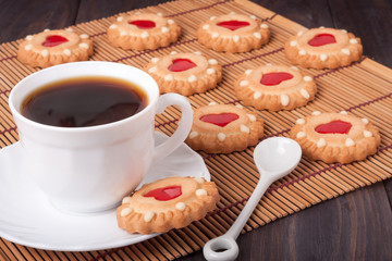 cookie with heart  jelly and cup of coffee bamboo napkin