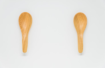 Two Classic wooden spoon with white background and selective focus