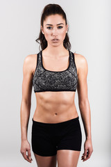 Fototapeta premium Young sport sexy fitness woman body on white background