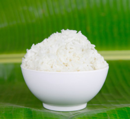 Rice in a bowl on banana leaf  background