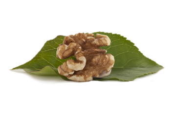 peeled walnut with leaves