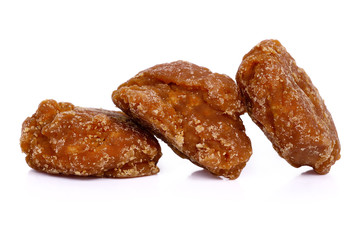 coconut flower sugar blocks on white background.