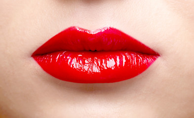 Fototapeta premium Beautiful model with make-up and red lips