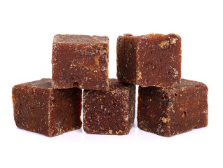 coconut flower sugar blocks on white background.