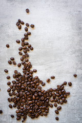 Coffee beans on concrete background