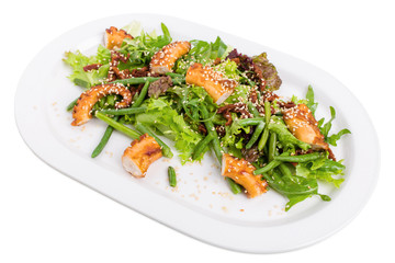Salad with grilled octopus and dried tomatoes.