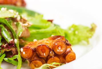 Salad with grilled octopus and dried tomatoes.