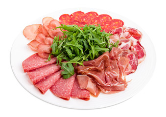 Delicious meat platter with arugula.