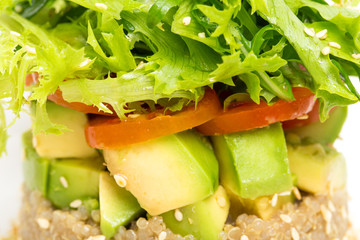  Quinoa salad with avocado and cherry tomatoes.