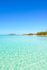 Tropical beach on Eleuthera on the Bahamas with turquoise water.