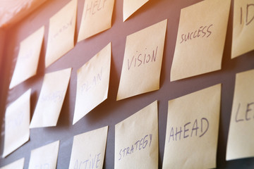 many sticky notes attached to blackboards