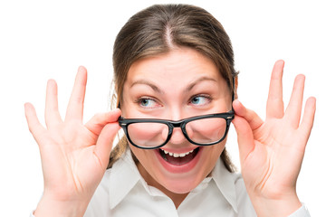 Surprised woman lowered her glasses face close-up isolated