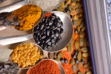 Various colorful spices on wooden table
