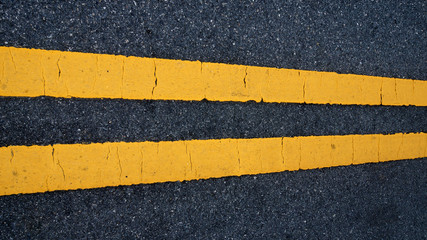 Fototapeta premium Two yellow traffic lines. on thr road.