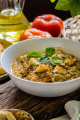 Gazpacho and ingredients on a table, vegetable soup