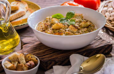 Gazpacho and ingredients on a table, vegetable soup