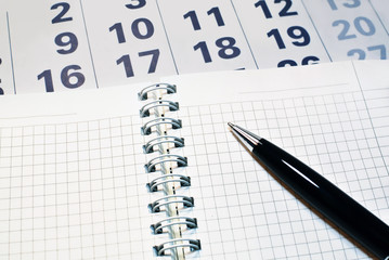 Calendar, notebook with blank page, pen, 