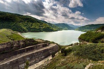 Fototapeta na wymiar Dam lake between mountains