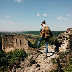 Man taking a photos of old ruined castle