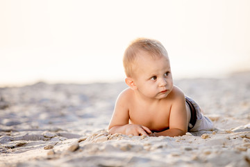 boy walking on the beach