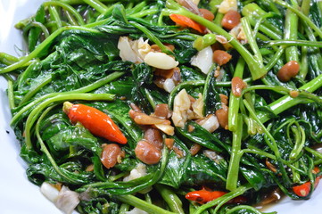 stir fried morning glory with soy bean paste on dish