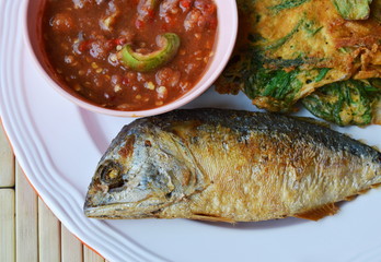 deep fried mackerel and egg eat couple with shrimp chili paste on dish