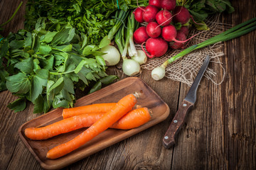 Fresh vegetables on a wooden table.