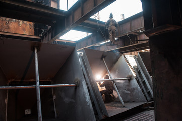 Two workers doing a industrial welding