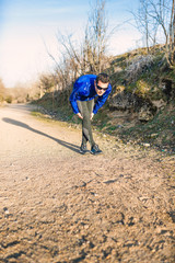 Obraz premium Man running in a promenade outdoors. Man is training
