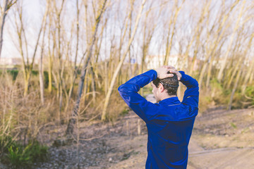 Man running in a promenade outdoors. Man is training