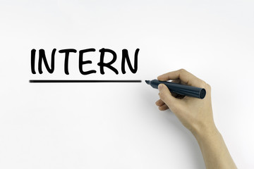 Hand with marker writing: INTERN