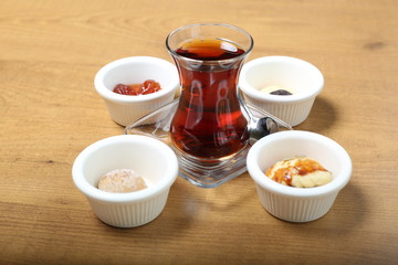 Turkish traditional tea in the incebelli glass with  sweets