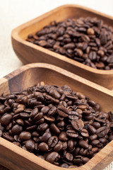a wooden container with coffee beans