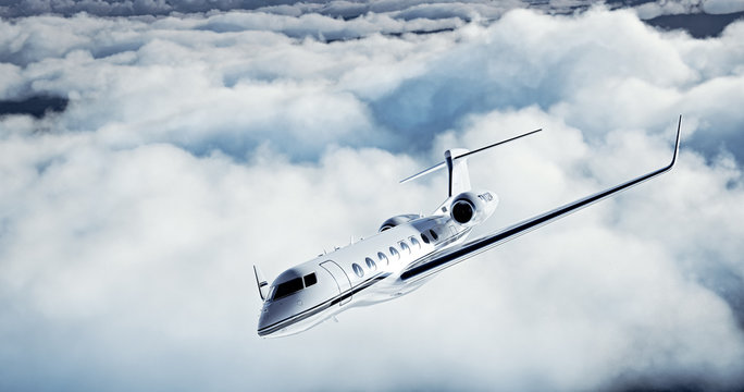 Photo of White Luxury generic design private jet flying over the earth. Huge white clouds at background. Business Travel Concept. Horizontal. 3d rendering