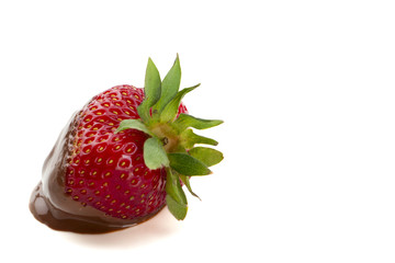 close up image of strawberry with melted chocolate