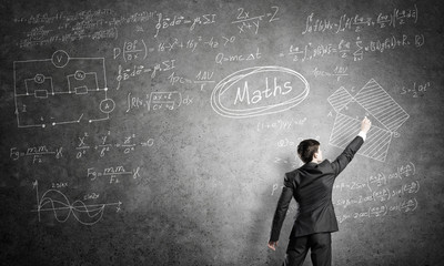 Man writing on blackboard