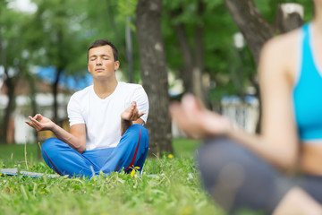 Fototapeta premium Having yoga practice in park