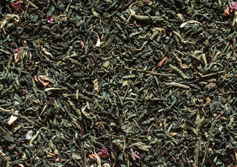 Dried green tea leaves background