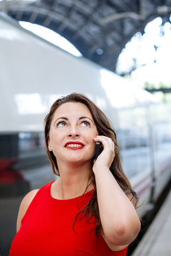 Woman waiting for the train at the station