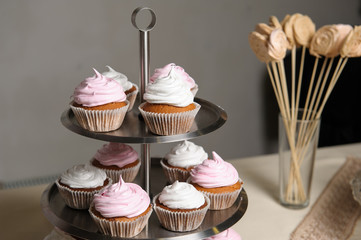 Delicious sweet buffet with cupcakes. Sweet holiday buffet with