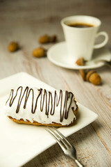 Cup of coffee, sweet buns and acorns