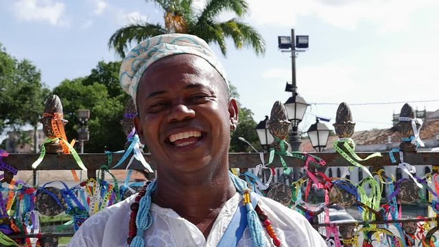 Brazilian man wearing traditional clothes at Bonfim Church in Salvador, Bahia, Brazil