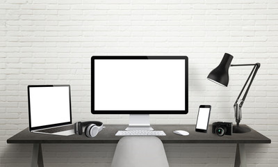 Responsive devices on desk with isolated screen for mockup. Computer display, laptop, tablet and smart phone. 